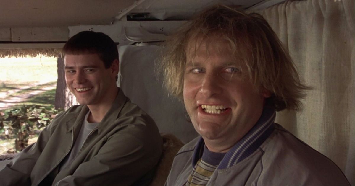 Jeff Daniels and Jim Carrey smile in a van in Dumb and Dumber