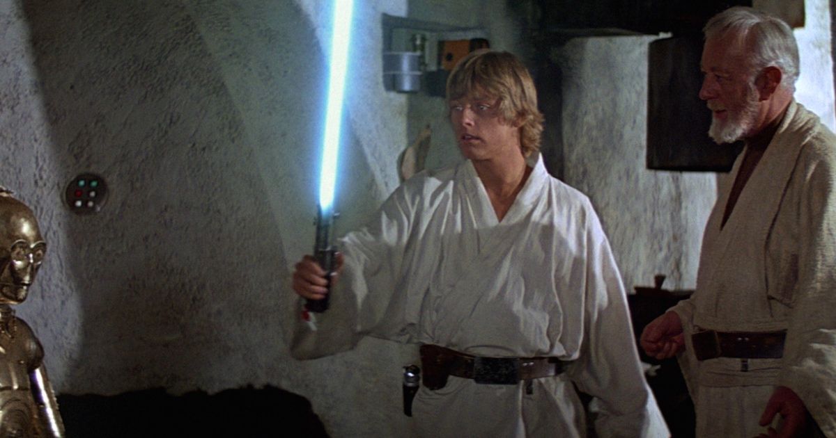 Luke Skywalker holds a lightsaber in star wars episode 4