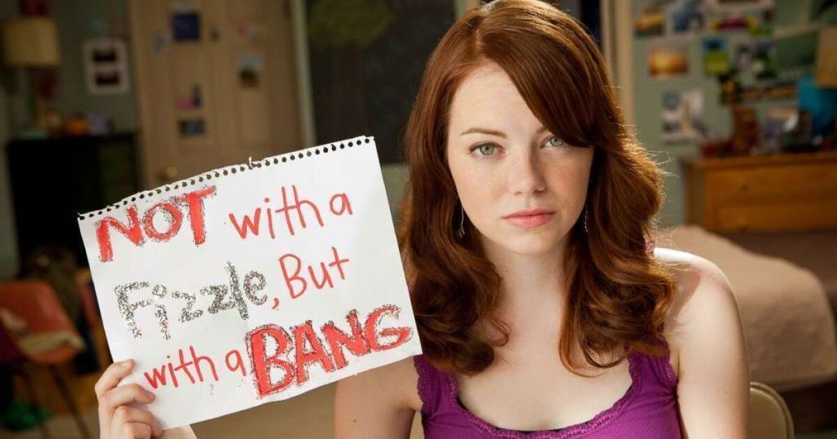 Emma Stone holds up a sign in Easy A