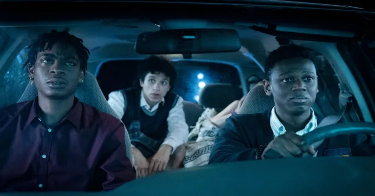 Teens drive nervously in a blue-lit car in Emergency 