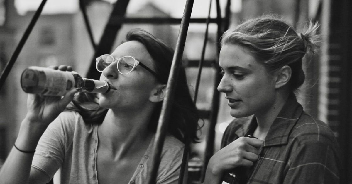 Two women drinking on the fire escape in Frances Ha
