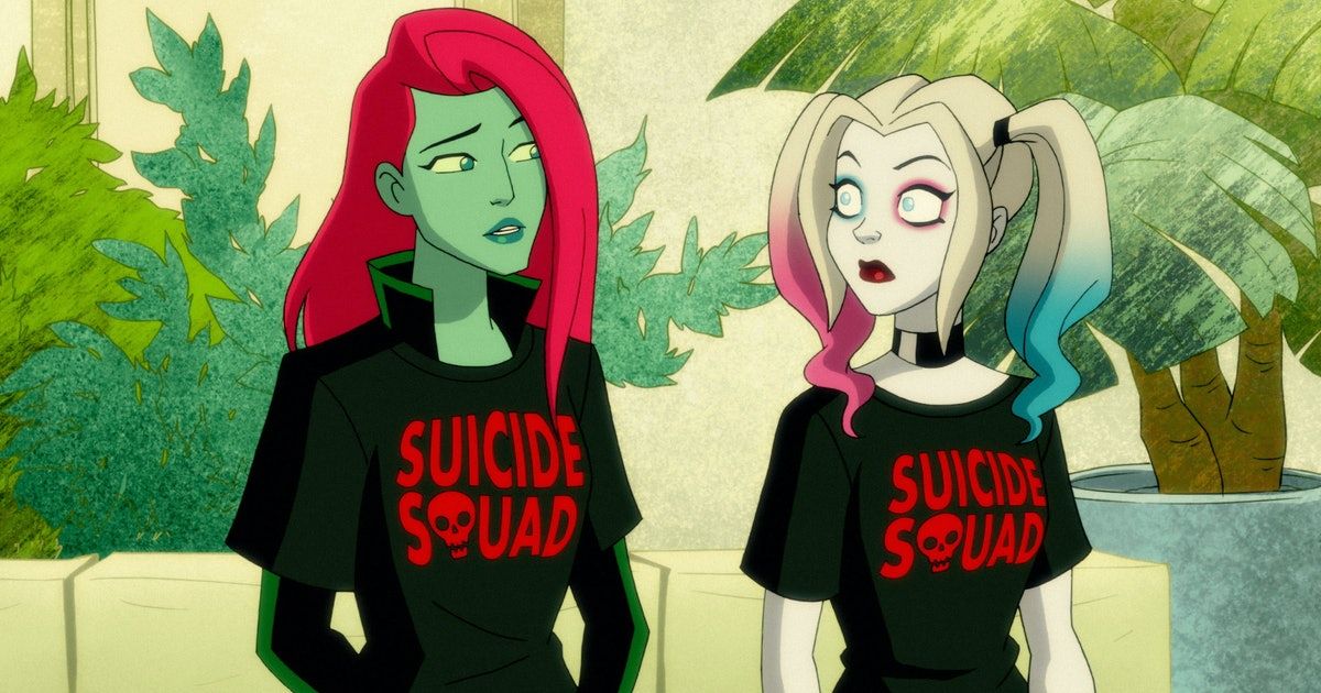 Poison Ivy and Harley Quinn stand next to each other in Suicide Squad black t-shirts.