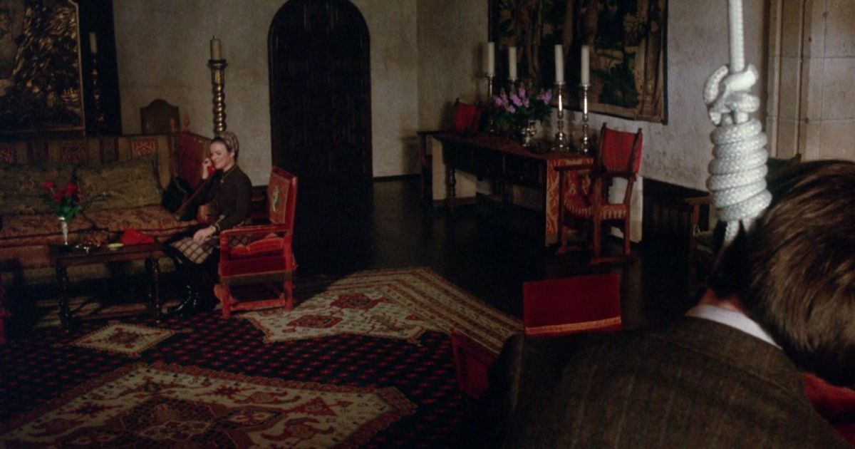 Bud Cort pretends to hang while his mom sits down and reads in Harold and Maude