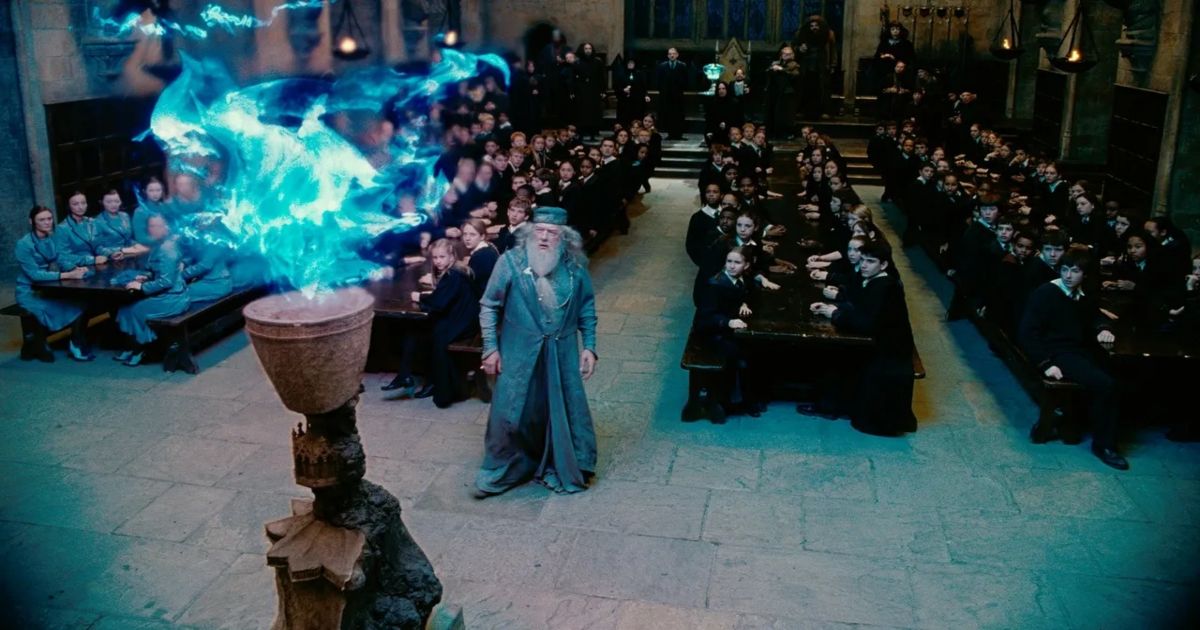 The young wizards at Hogwarts and Dumbledore stand back and watch the blue flames of the goblet in Harry Potter and the Goblet of Fire