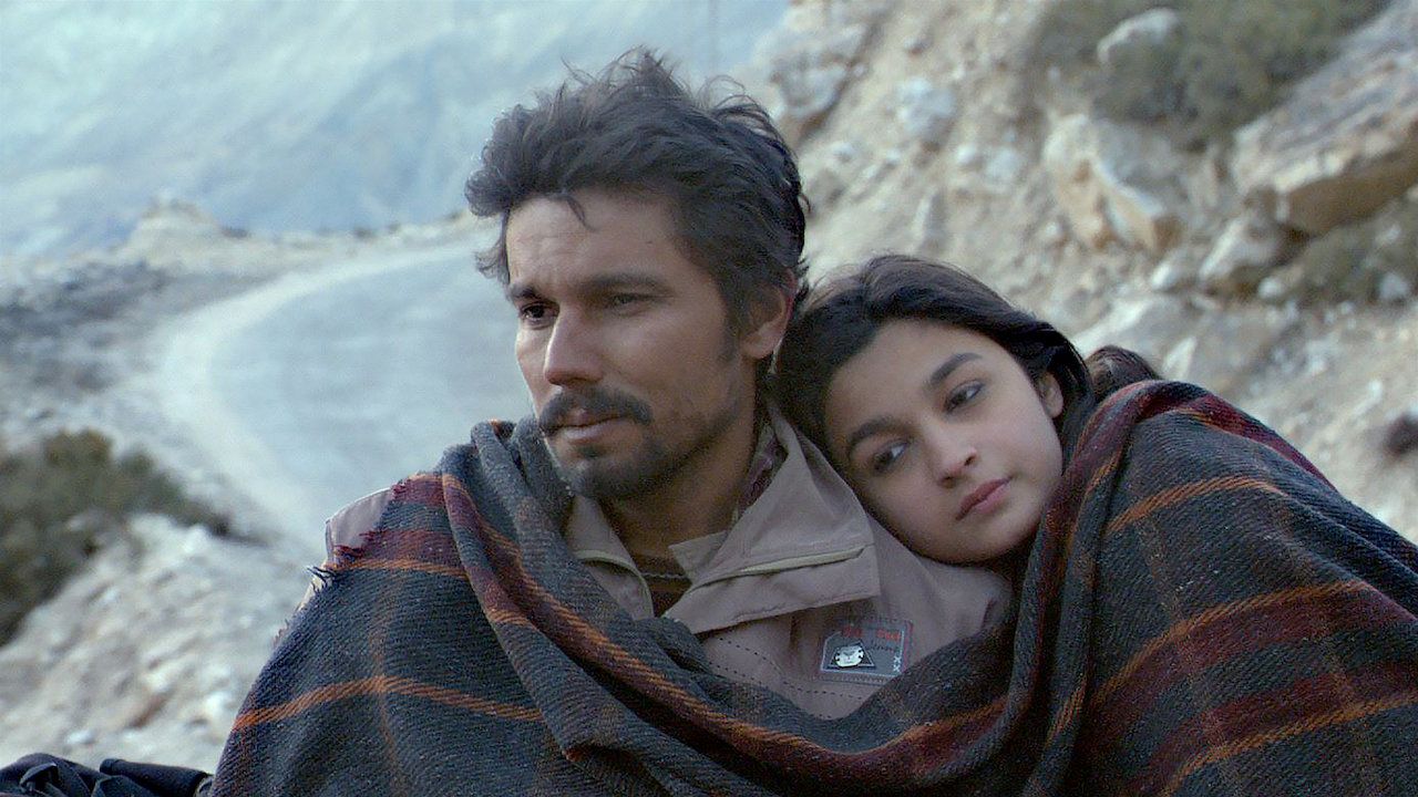 Girl leans on man's shoulder. 