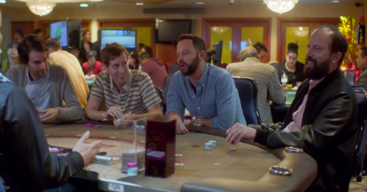 The cast sits at a poker table in Joshy