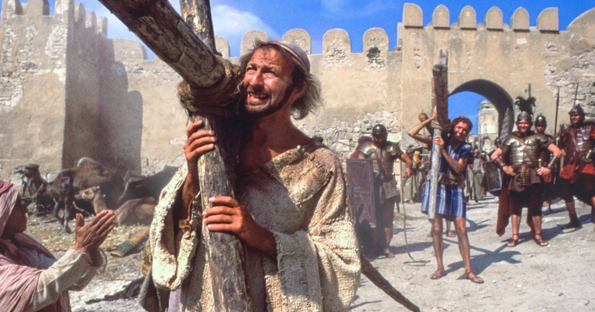 Brian carries a huge cross in Life of Brian