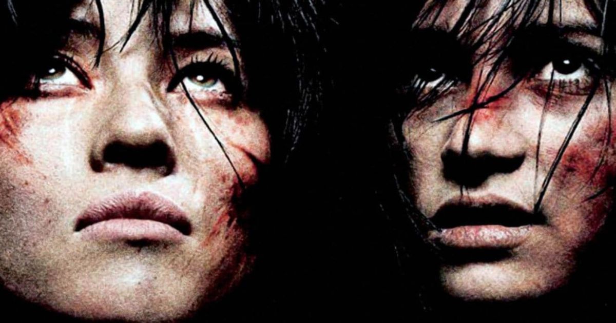 The faces of two bloody women in the dark in Martyrs