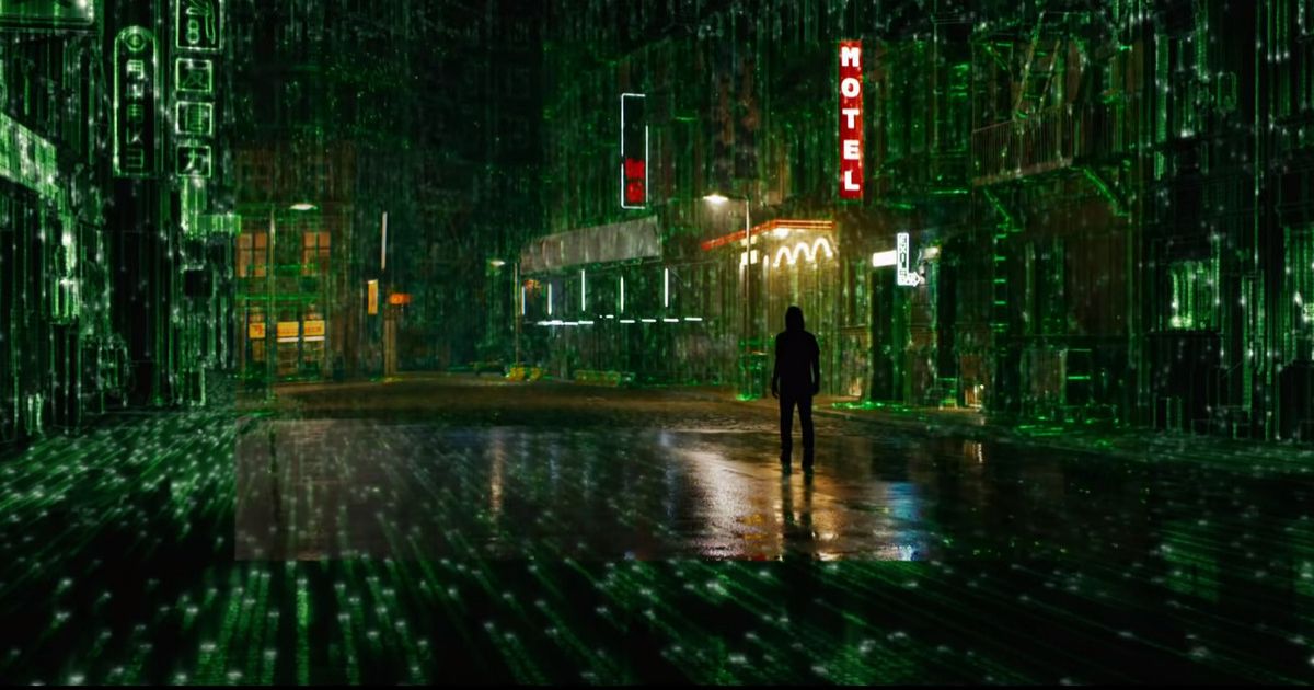 Someone stands in the street as it rains and makes the world look like green digital code in Matrix Resurrections 