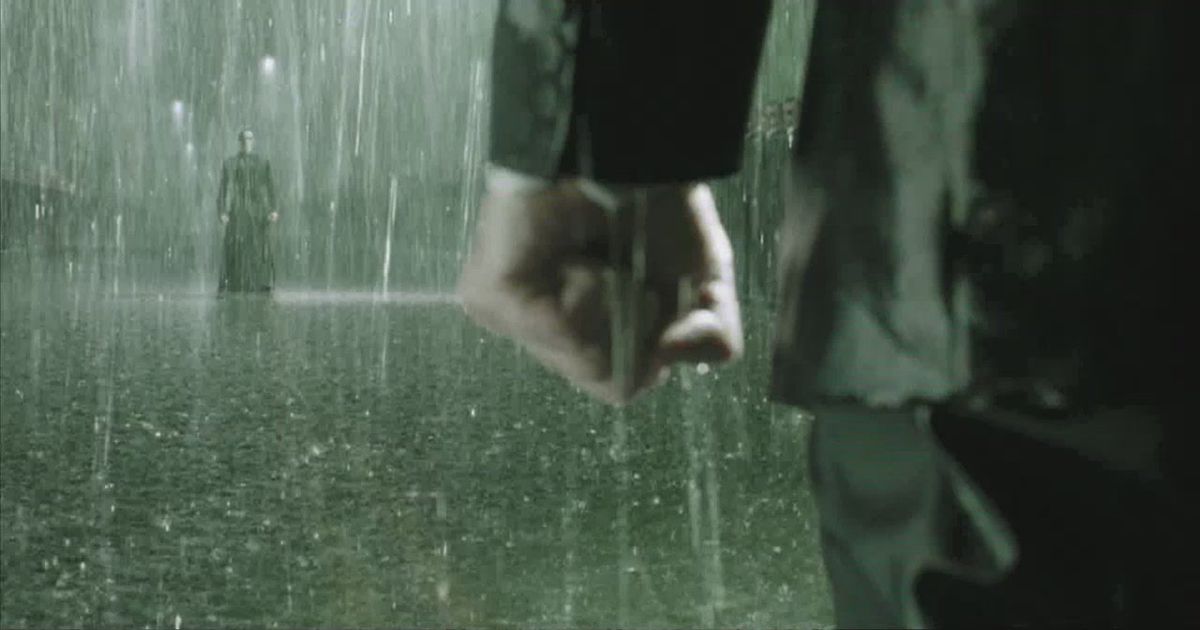 The clenched fist of Agent Smith in the rain as he stares down Neo in The Matrix Revolutions