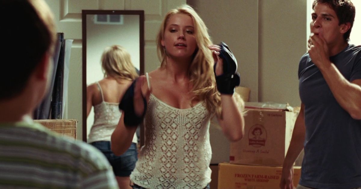 Amber Heard in Never Back Down wearing fighting gloves and mid fight. 