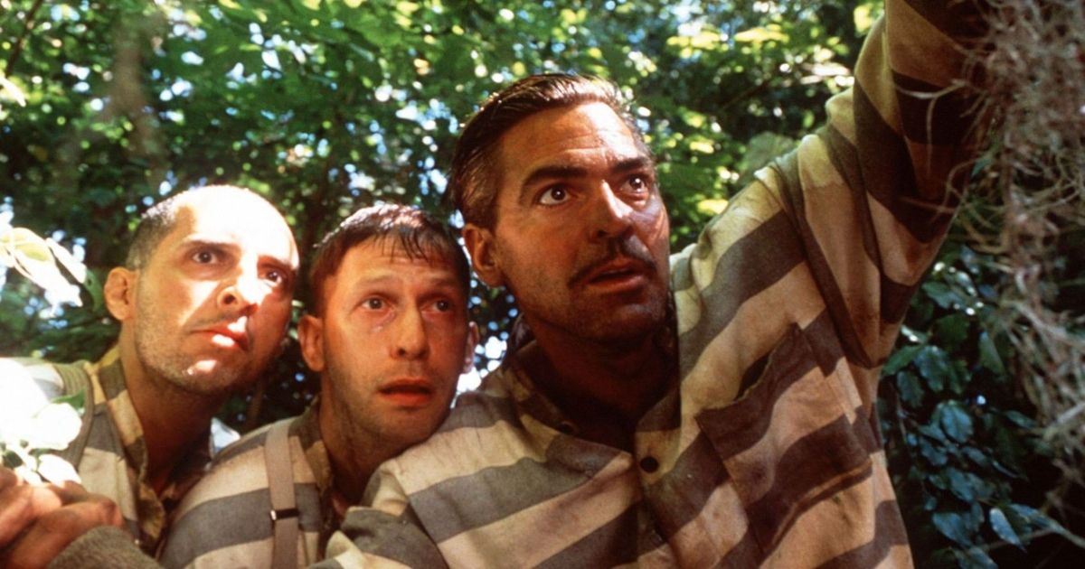 John Turturro, Tim Blake Nelson, and George Clooney wear prison outfits in O Brother Where Art Thou