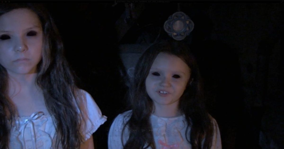 Two young girls with black eyes in Paranormal Activity - The-Marked-Ones