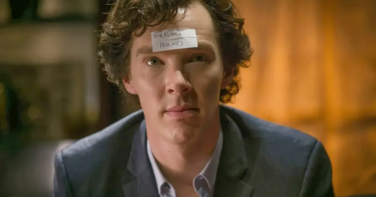 Sherlock Holmes with a name tag on his forehead, played by Benedict Cumberbatch