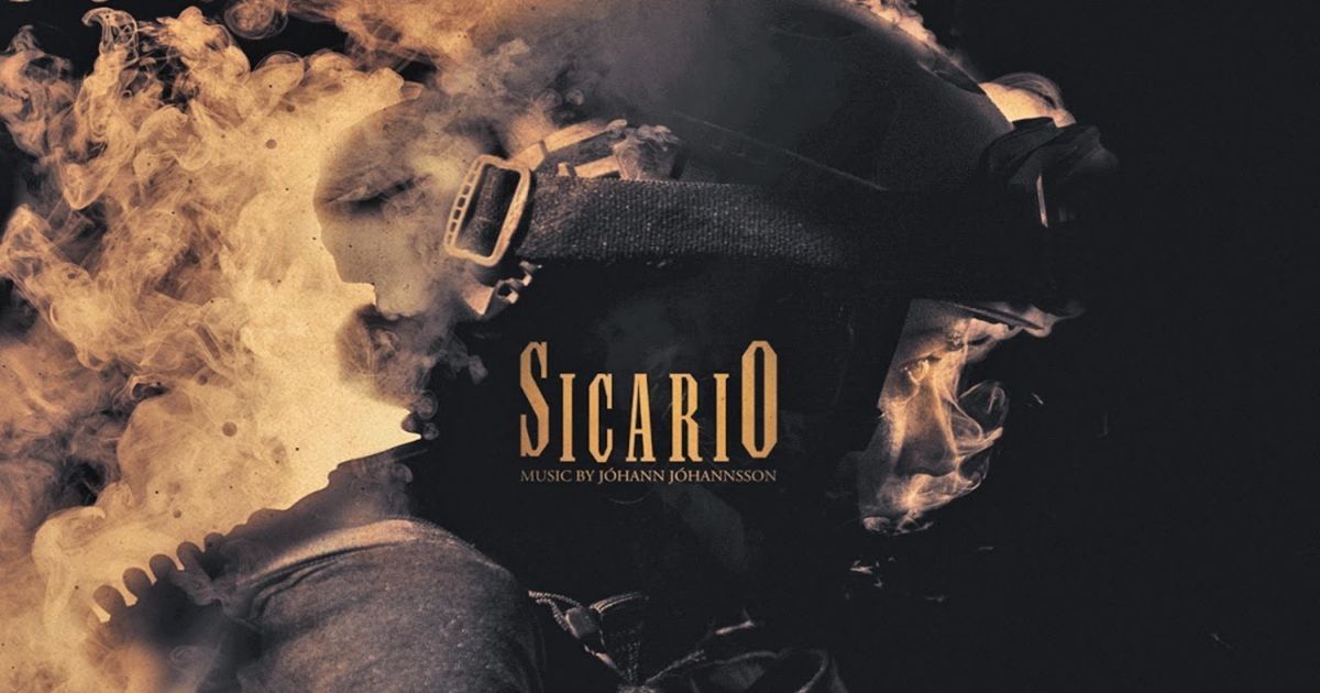 A helmet surrounded by smoke in the cover art for the Sicario Original Score