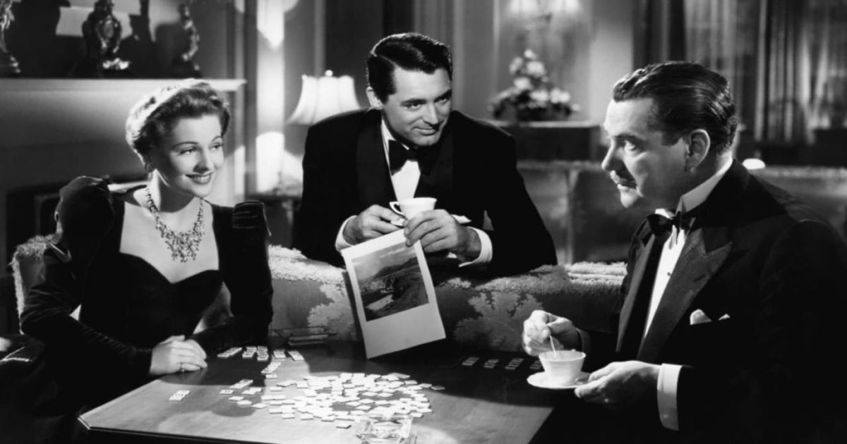 Cary Grant holds espresso in a tuxedo in Suspicion