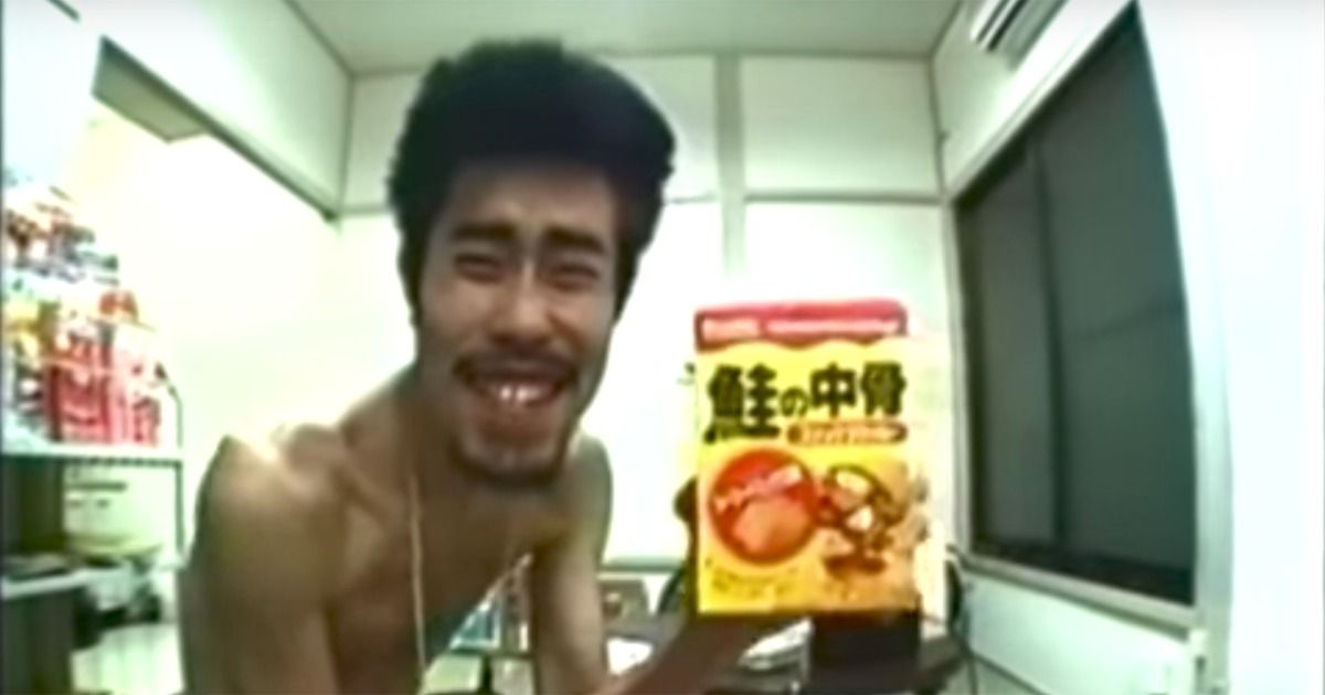 A very skinny Nasubi showing off food he has won in Susunu! Denpa Shonen
