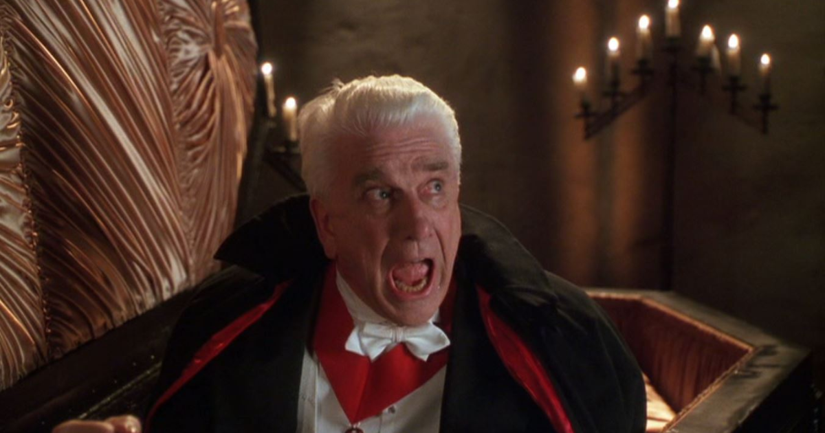 Leslie Nielsen climbs out of a coffin in Dracula Dead and Loving It