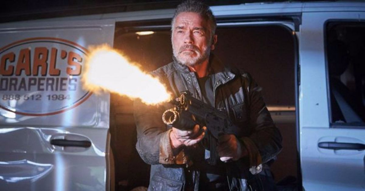 Schwarzenegger shoots a flame thrower outside a parked van in Terminator Dark Fate