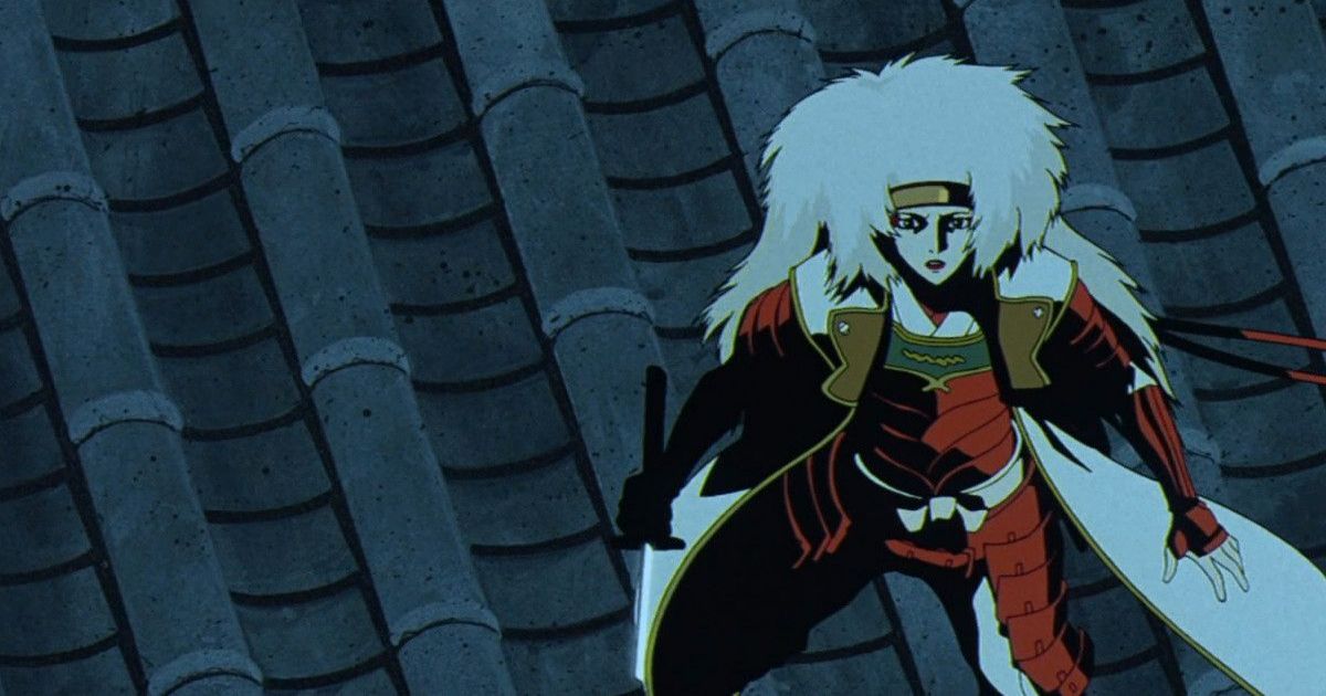 A woman with a cape and sword on the roof in The Animatrix