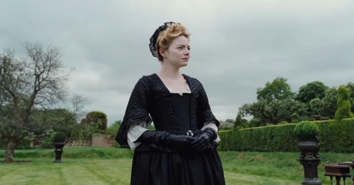 Emma Stone in a black dress in The Favourite