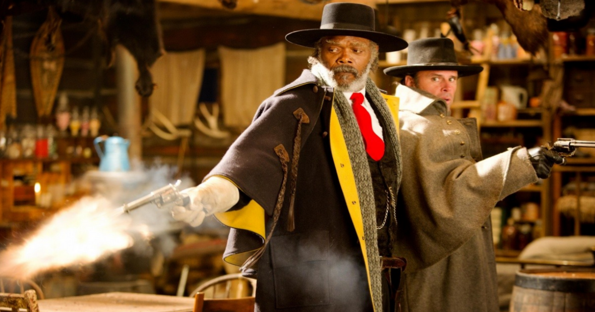 Samuel L. Jackson and Walton Goggins shoot guns back to back in The Hateful Eight