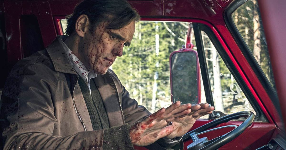 Matt Dillon stares at his bloody hands in a van in The House That Jack Built 