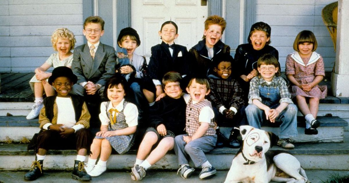The titular The Little Rascals sit on the porch steps