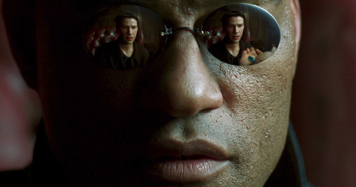 A reflection of Keanu Reeves as Neo in Morpheus' glasses in The Matrix