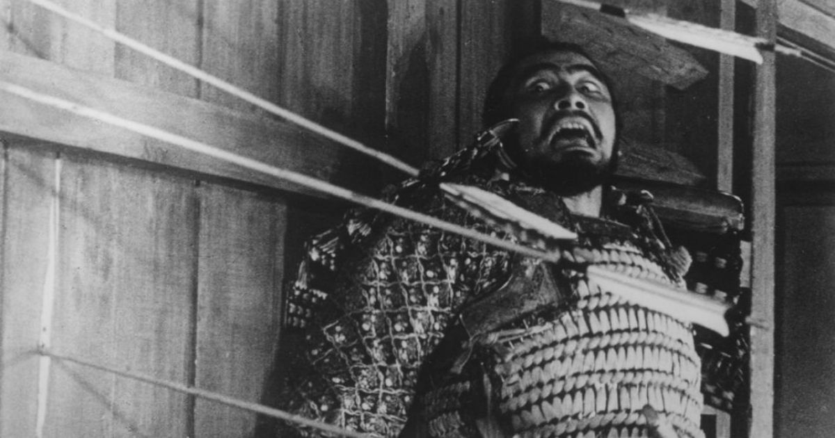 Toshiro Mifune screams as arrows are shot next to him in Throne of Blood 