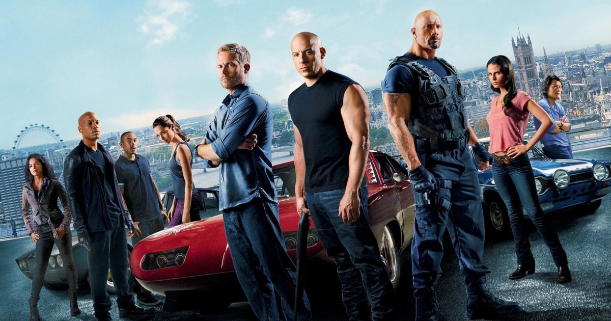 The cast of Fast and Furious 6 around a car