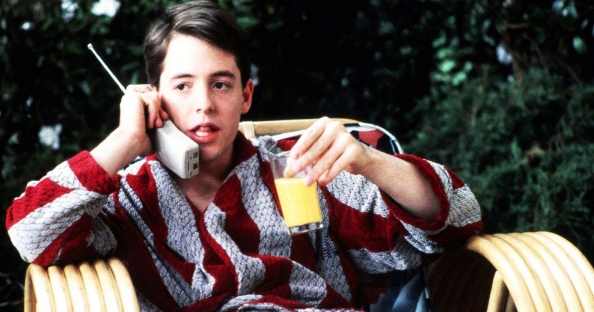 Ferris Bueller drinking orange juice and talking on the phone to the principal. 