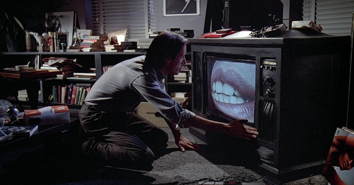James Woods messing with a TV in Videodrome