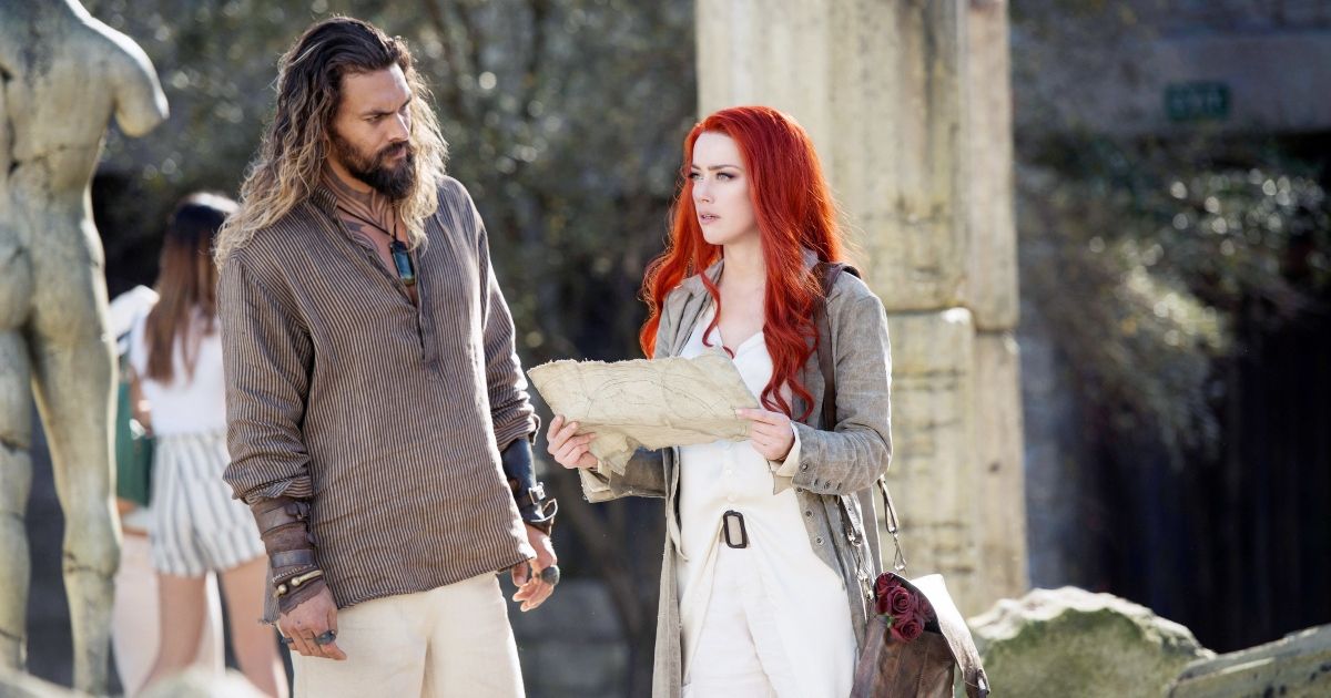 Jason Momoa and Amber Heard in Aquaman, looking at a map.