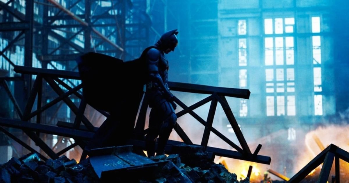 Batman standing in rubble in Gotham in The Dark Knight (2008)