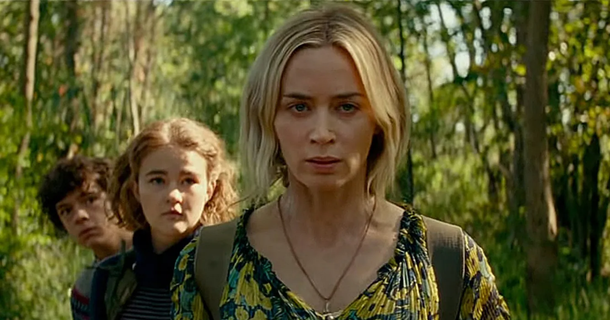 Emily Blunt leads her children through the grass in A Quiet Place 2