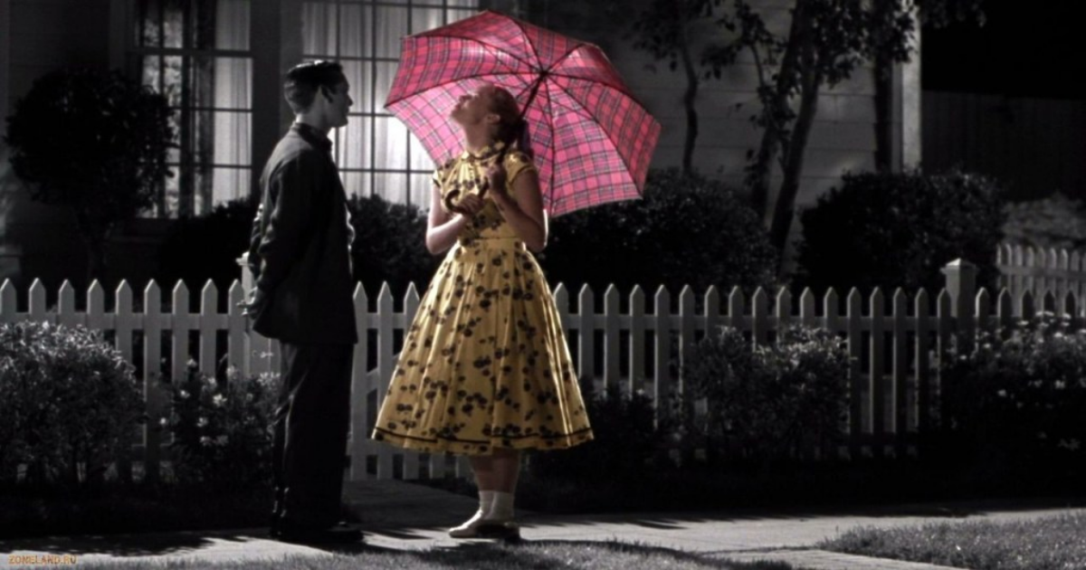 A pink umbrella in the black and white streets of Pleasantville