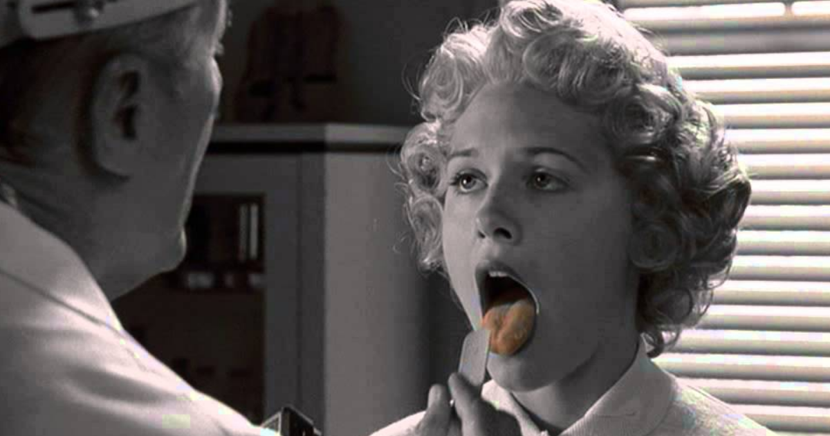 A woman's red tongue in the doctor's office in the black and white Pleasantville