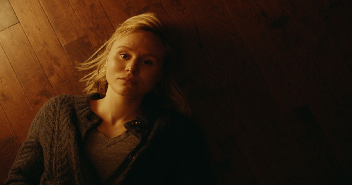Alison Pill laying on the floorboards in All My Puny Sorrows