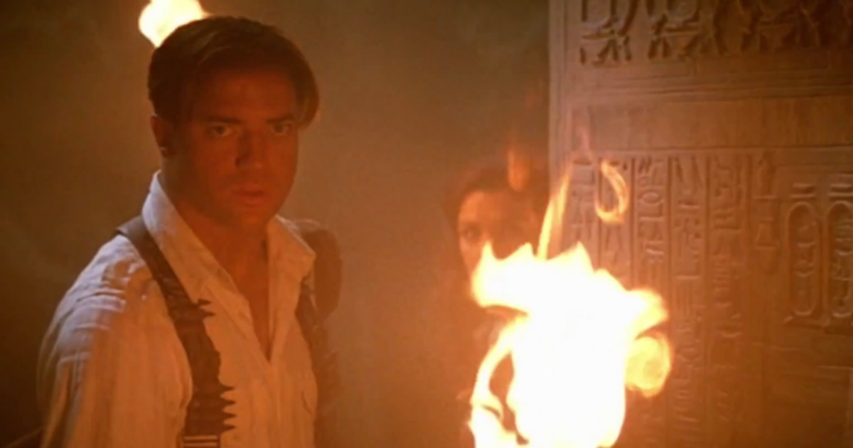 Brendan Fraser holds a torch in the tombs of The Mummy Returns