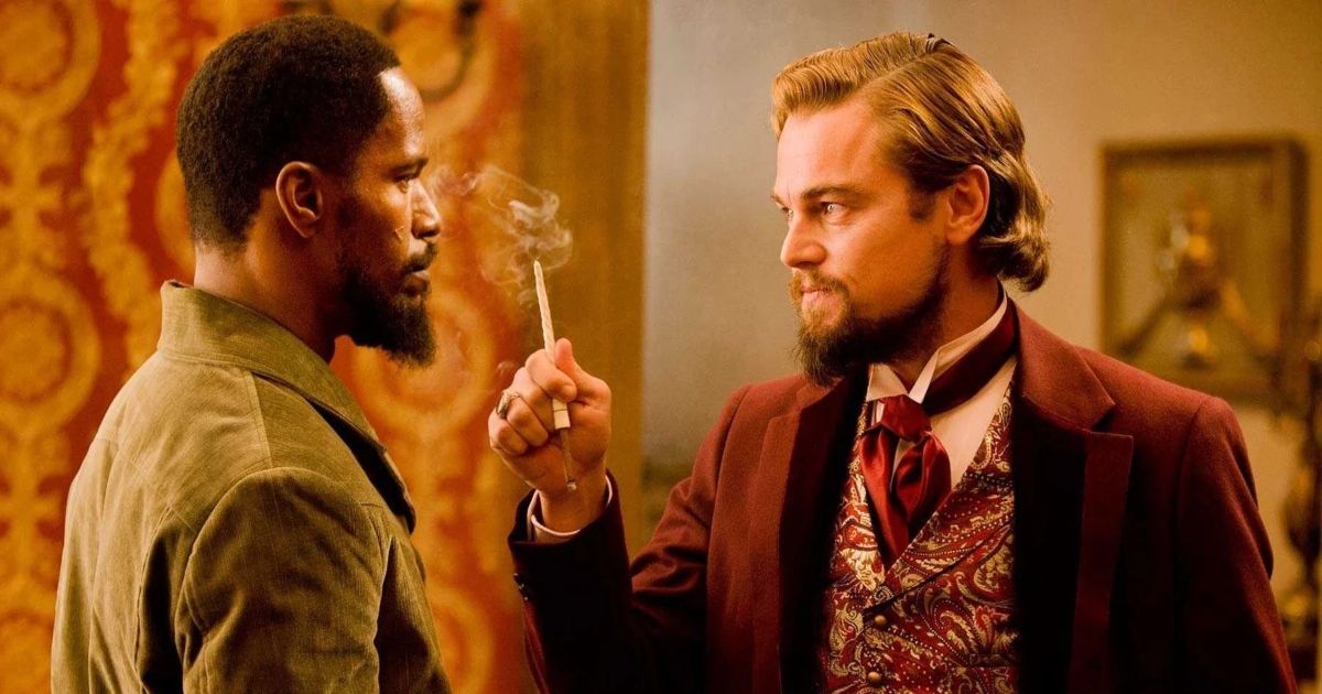 Leonardo DiCaprio as Calvin Candie smoking a cigarette and talking to Jamie Foxx in Django Unchained