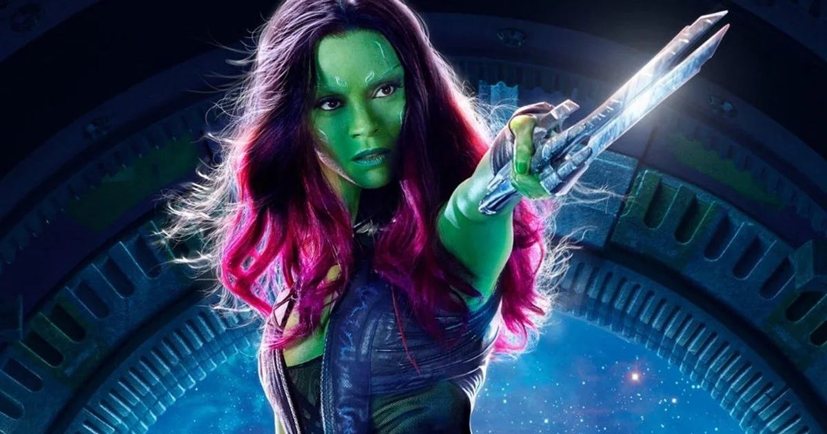 Gamora pointing a sword past the camera.