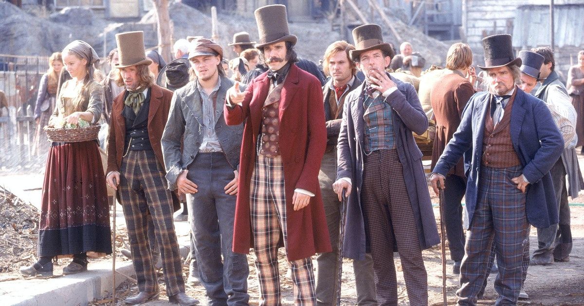 Group of men in plaid pants and 1800s coats gather in Gangs of New York