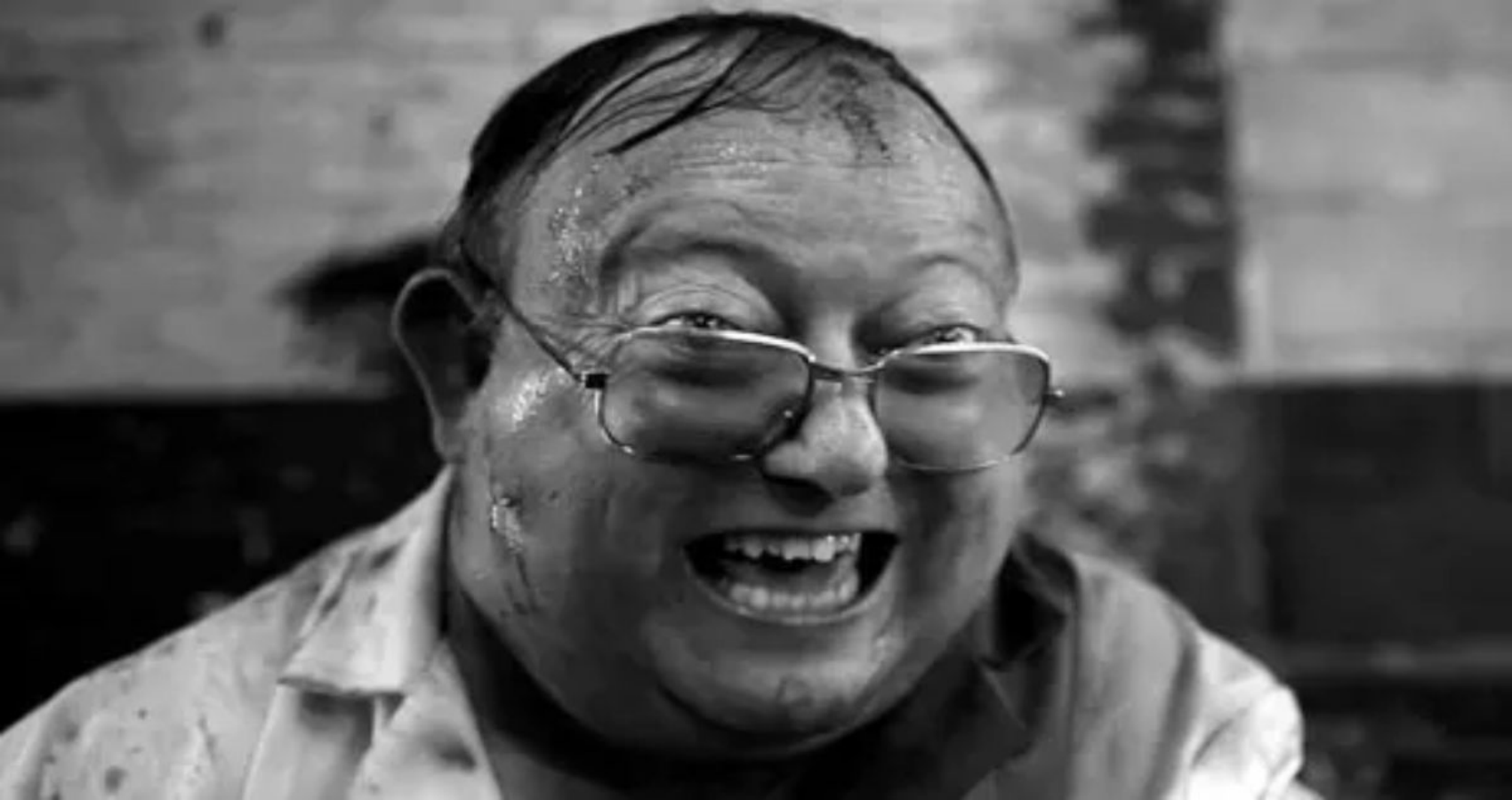 The mad scientist laughs in black and white in Human Centipede 2