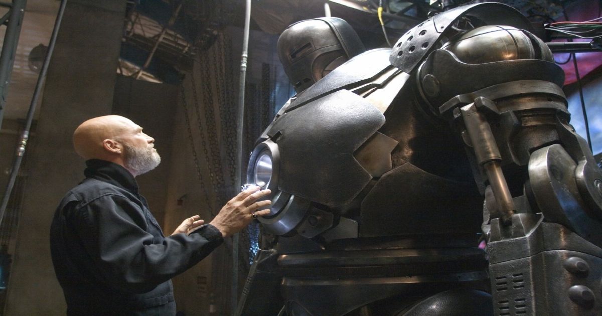 Jeff Bridges looking at a suit of armor in Iron Man