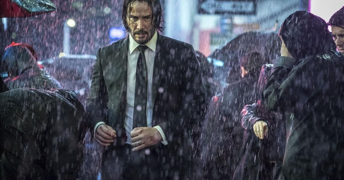 Keanu Reeves walks in the rain in John Wick