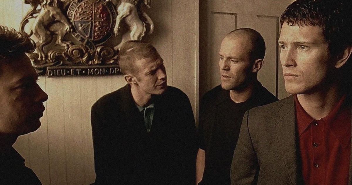 Group of men stand around talking in Lock, Stock, and Two Smoking Barrels