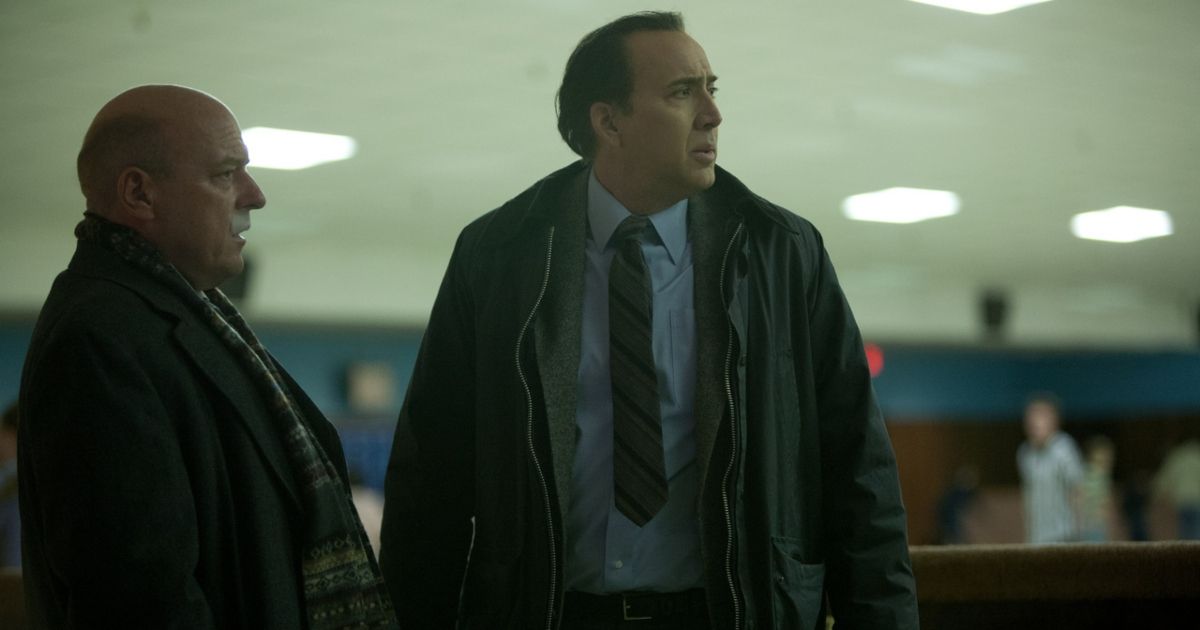 Nicolas Cage in The Frozen Ground wearing a tie and a winter jacket