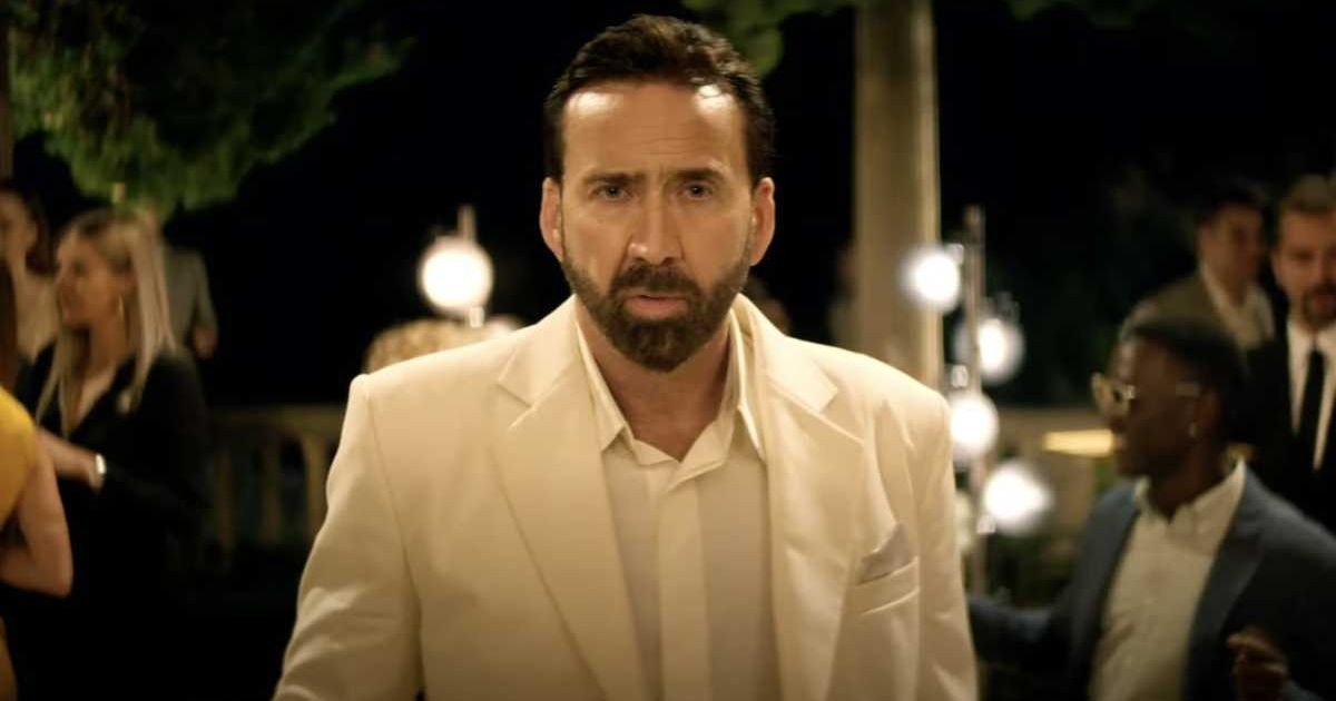 Nicolas Cage in a white suit for The Unbearable Weight of Massive Talent