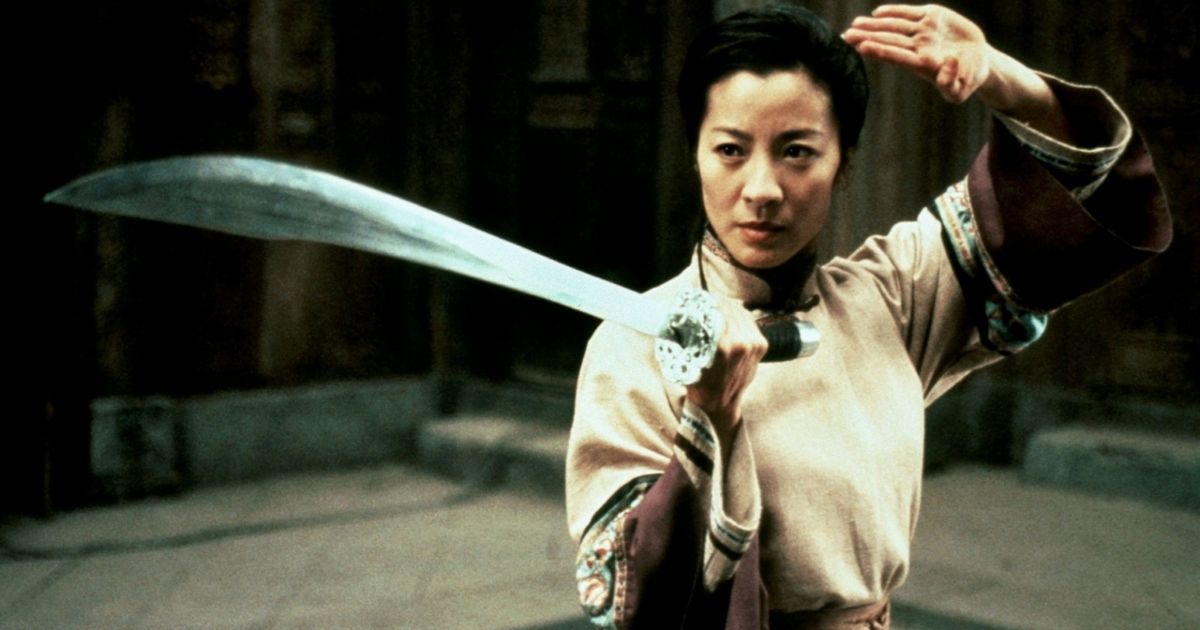 One of the actresses in Crouching Tiger, Hidden Dragon posing with a sword